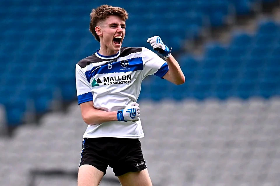 Gaelic footballer celebrating while wearing PalmPro strapped gloves